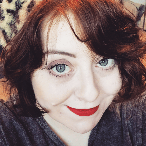 A close-up selfie of a person with short, red hair.