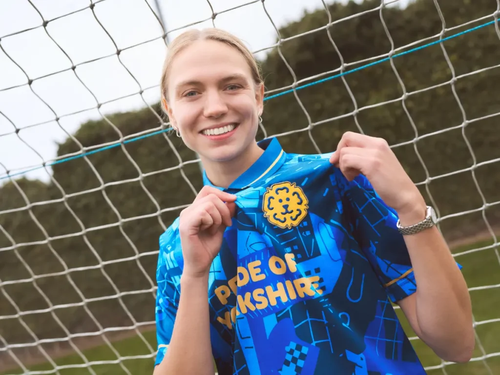 Esme Morgan wearing Pride of Yorkshire merchandise