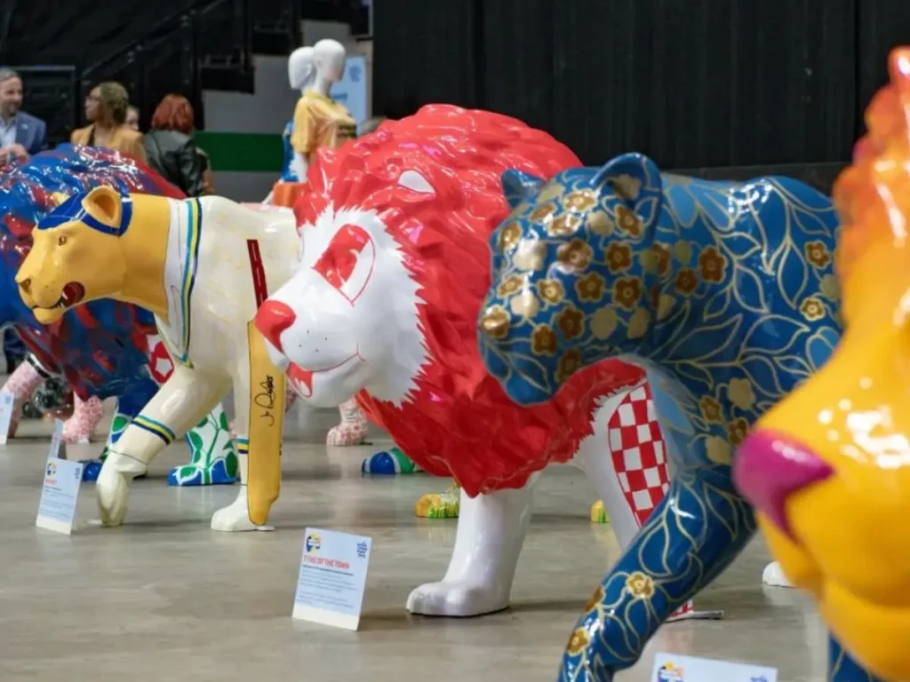 An image of 4 side-by-side Pride of Yorkshire lion sculptures