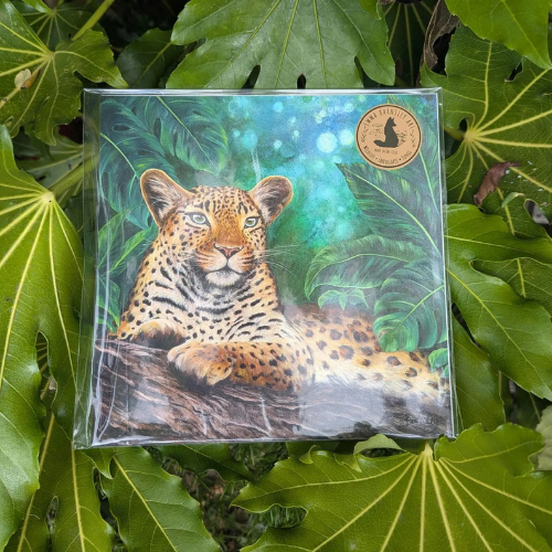 A leafy background surrounds a stunning print of a hand drawn leopard.