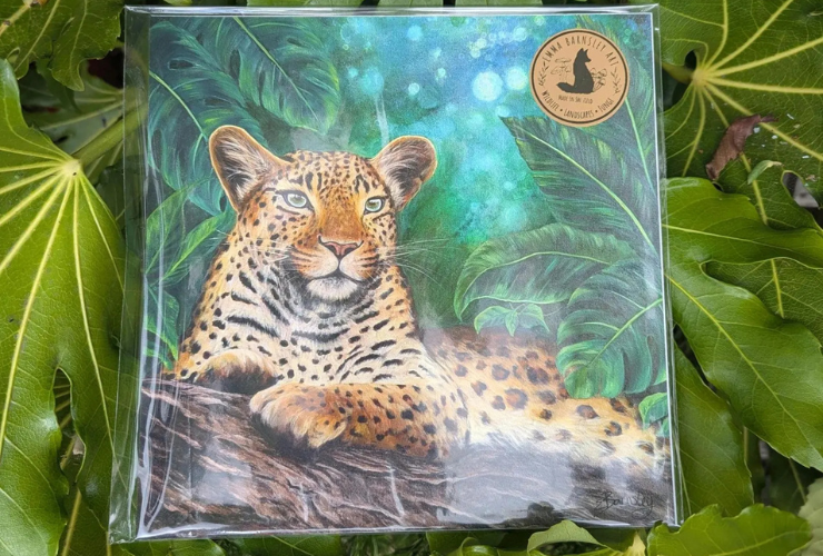 A leafy background surrounds a stunning print of a hand drawn leopard.